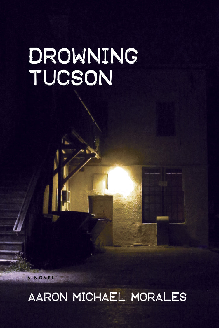 Cover of "Drowning Tucson," which is a photo of the back entrance of a house, with a dumpster, a lit porch lamp, and a staircase. 