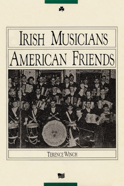 Cover of "Irish Musicians/American Friends," by Terence Winch, which features a black and white photograph of a band holding their instruments. There is also a small four leaf clover and the top of the cover, and a small American flag at the bottom of the cover. 