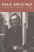 Cover of "Paul Metcalf Volume Two," by Paul Metcalf, which features a black and white image of a man in glasses smiling at the camera and leaning against a railing. 